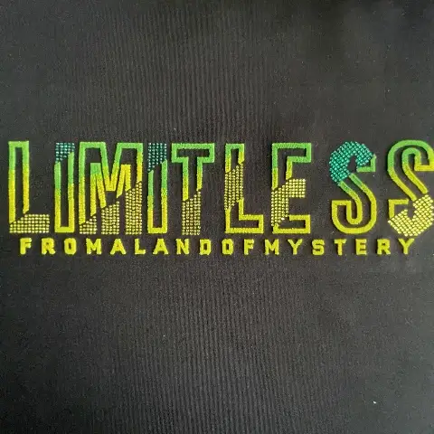 Short-pile thin-plush gradient lettering in toothbrush embroidery, accented with