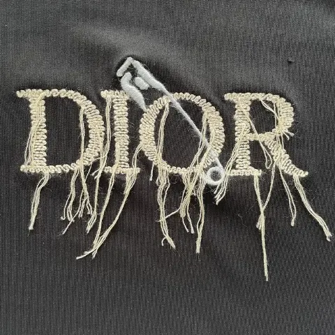 Custom distressed tassel embroidery with loose ends + wool-thread embroidered letters