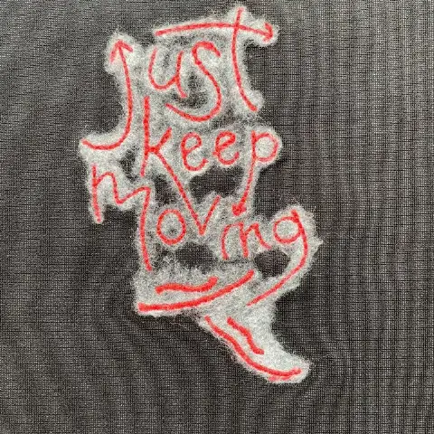 Street dark-style trendy needle-pile embroidery with cursive English lettering on a feather-textured background